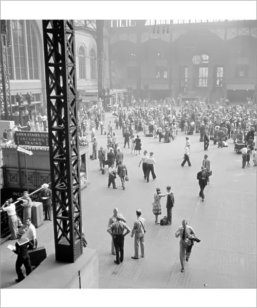 NYC: PENN STATION, 1942. Passengers in the concourse at Penn Station in New York City