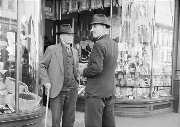 NEW YORK: AMSTERDAM, 1941. Men on the street in Amsterdam, New York. Photograph by John Collier
