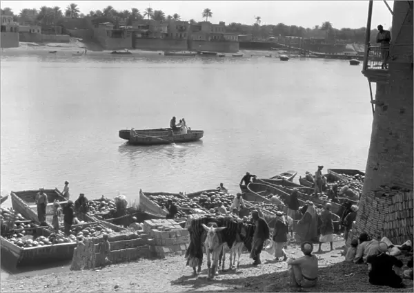 BAGHDAD: TIGRIS RIVER, 1932. Boats unloading on the Tigris river in Baghdad, Iraq