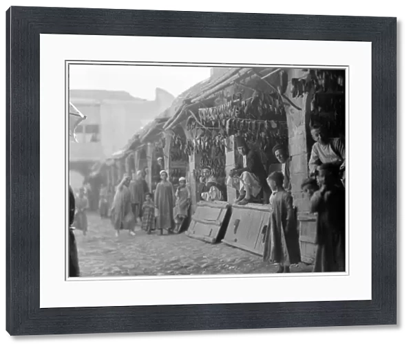 BAGHDAD: MARKET, 1932. Shoe sellers at a market in Baghdad, Iraq, 1932