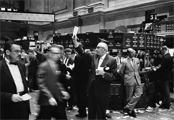STOCK EXCHANGE, 1963. Stock brokers trading on the floor of the New York Stock Exchange