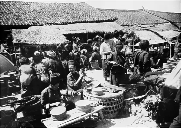CHINA: MARKET, c1940. An outdoor market in Chefang, China. Photograph, c1940