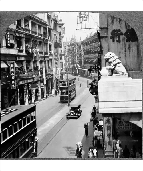 CHINA: HONG KONG, c1935. A busy street in the shopping district of Victoria, Hong Kong, China