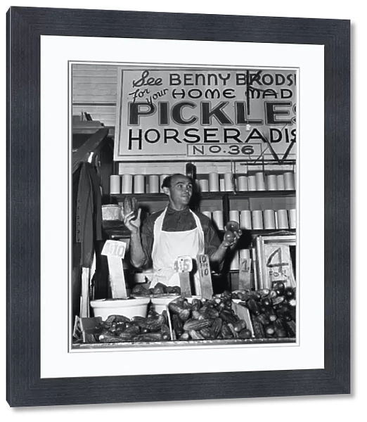 BROOKLYN: PUSHCART, 1940. Benny Brodsky, a pushcart vendor, at his pickle stand in Brooklyn