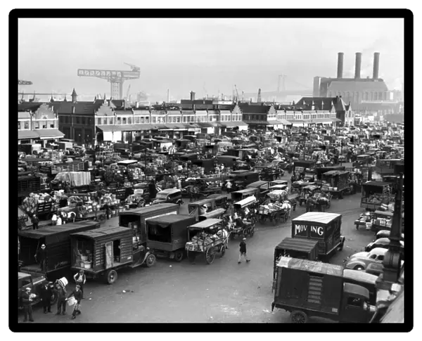 BROOKLYN: MARKET, 1940. A crowd of trucks and horse-drawn carts at Wallabout Market in Brooklyn