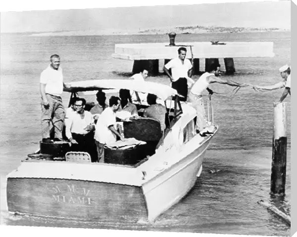 FLORIDA: CUBAN REFUGEES. A boat filled with Cuban refugees throwing a mooring line