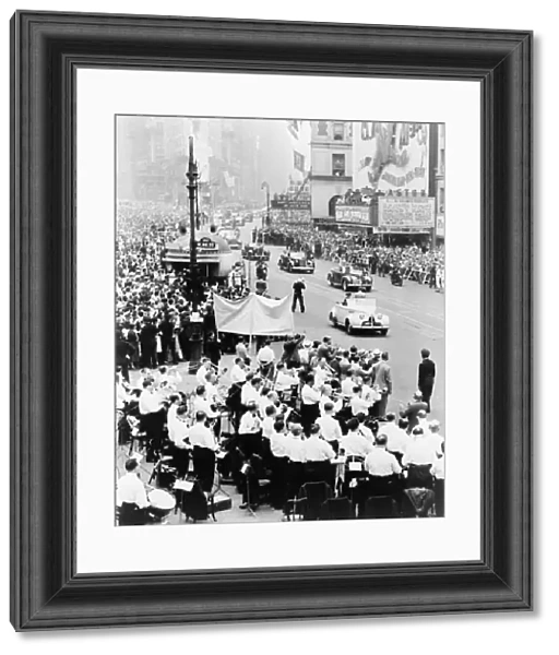 EISENHOWER: VICTORY PARADE. A parade up Broadway in New York City headed by a car