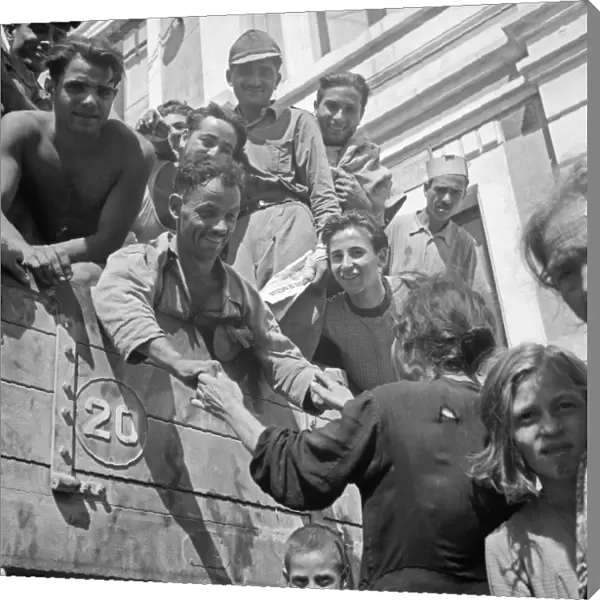 WWII: SICILY, 1943. Sicilian soldiers returning home after being freed from prison