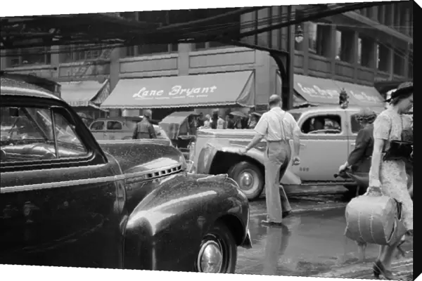 CHICAGO: TRAFFIC, 1941. Jaywalkers in traffic in Chicago, Illinois. Photograph by John Vachon