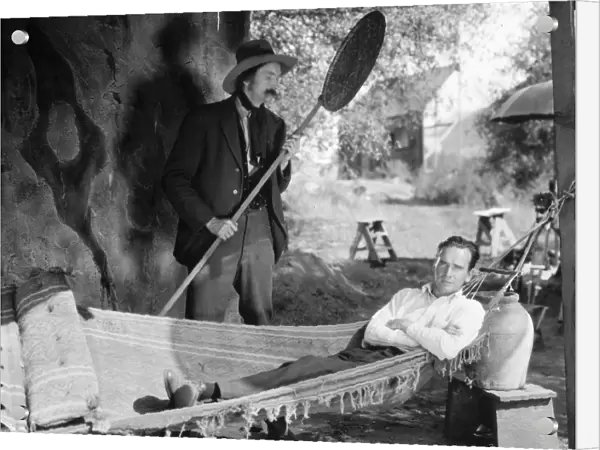 HAMMOCK, 1925. Director William K. Howard tries out a hammock on the set of the film The Light of the Western Star, 1925