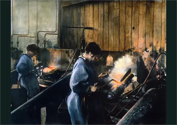 WORLD WAR I: WOMEN WORKERS. Women welding bomb casings in an American munitions factory, c1917. Oil over a photograph
