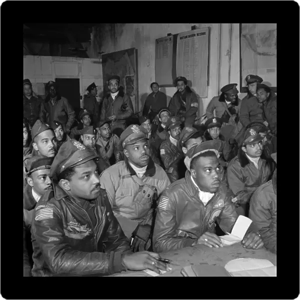 TUSKEGEE AIRMEN, 1945. Tuskegee Airmen at a briefing at Ramitelli Airfield, Italy. Photograph by Toni Frissell, March 1945