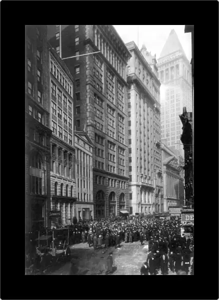 FINANCIAL CENTER, c1920. Crowd of men involved in curb exchange trading on Broad Street, New York City. Photograph, c1920