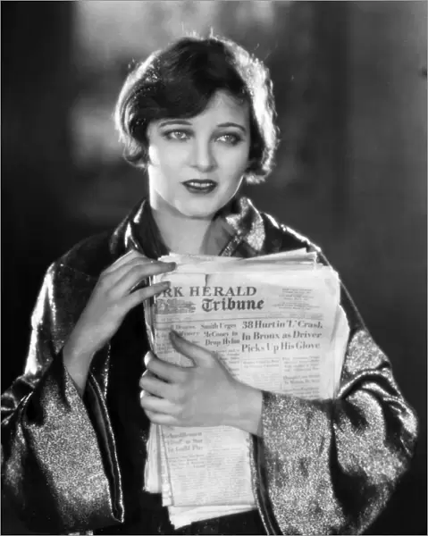 SILENT FILM STILL: READING. Corinne Griffith in Classified, 1925