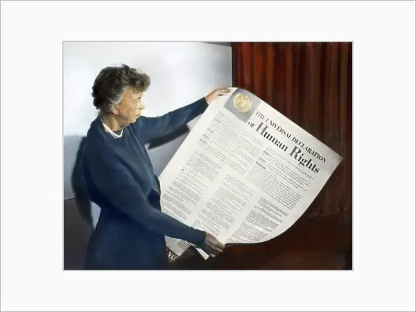 ANNA ELEANOR ROOSEVELT (1884-1962). Mrs. Franklin Delano Roosevelt. Eleanor Roosevelt holding a Universal Declaration of Human Rights poster at Lake Success, New York. Oil over a photograph, November 1949