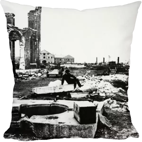 CIVIL WAR: CHARLESTON. A man seated among the ruins in Charleston, South Carolina, after the attack by General Sherman, 1865