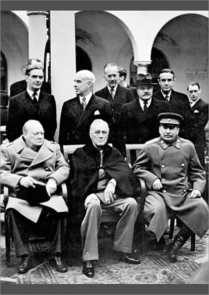 Winston Churchill, Franklin D. Roosevelt and Joseph Stalin at the Yalta Conference at Livadia Palace, Yalta, Crimea. Standing left to right: Anthony Eden, Edward Stettinius, Alexander Cadogan, Vyacheslav Molotov and W. Averell Harriman. Photograph, February 1945