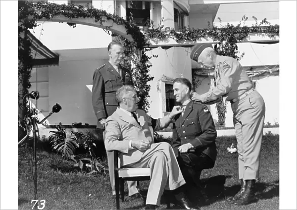 President Franklin D. Roosevelt with Major General George Smith Patton, affixing the Congressional Medal of Honor upon Brigadier General William H. Wilbur in the presence of General George C. Marshall, at the Casablanca Conference in Casablanca, Morocco, January 1943