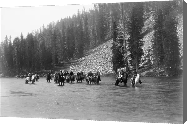 American President Chester Alan Arthur with an expedition team crossing the Snake River at Lewis Fork in Yellowstone National Park. Photograph by Frank Jay Haynes, 1883