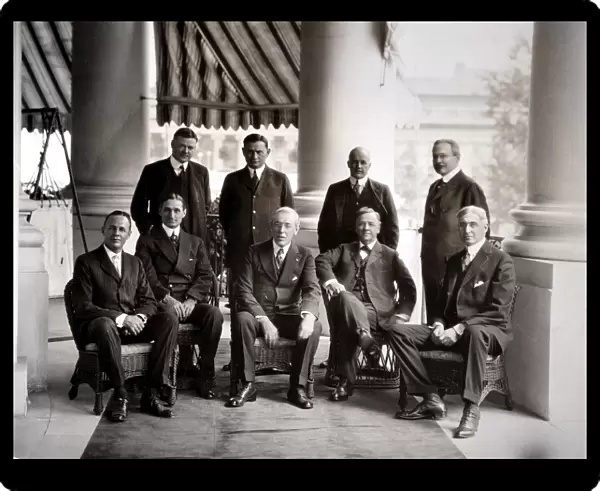 28th President of the United States. President Woodrow Wilson at the White House with some of his advisers, including Treasury Secretary William Gibbs McAdoo (front row, second from left); Bernard Baruch (front row, far right), and Herbert Hoover (back row, far left)