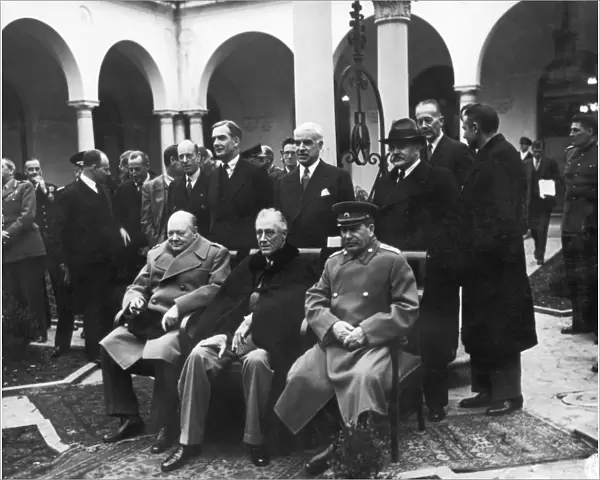 Allied leaders photographed at the Livadia Palace at Yalta, Crimea, during the Yalta Conference, February 1945. Seated from left: British Prime Minister Winston Churchill, U. S. President Franlin Roosevelt, and Soviet Premier Joseph Stalin
