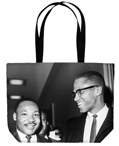 Dr. Martin Luther King Jr. (left), American cleric and civil rights leader, photographed with American religious and political leader Malcolm X at the Capitol in Washington, D. C. 26 March 1964