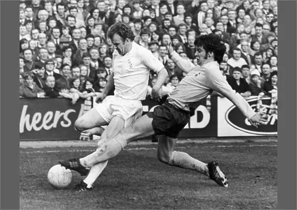 ENGLAND: SOCCER MATCH, 1972. Soccer match between Leeds United and Tottenham Hotpur during the FA Cup, 18 March 1972. Leeds captain Billy Bremner is tackled by Cyril Knowles
