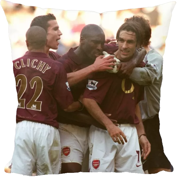 Robert Pires celebrates scoring the Arsenal goal with Sol Campbell, Gael Clichy