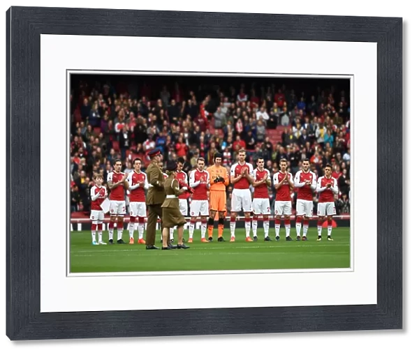 The Arsenal team clap the soldiers with the rememberance reef before the match. Arsenal 2