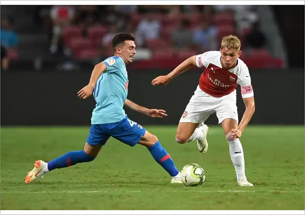 Arsenal's Emile Smith Rowe Clashes with Atletico Madrid's Joaquin Munoz in International Champions Cup 2018