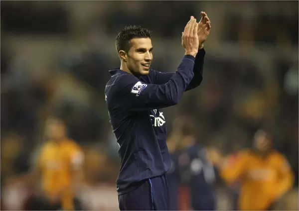 Robin van Persie salutes the Arsenal fans after the match
