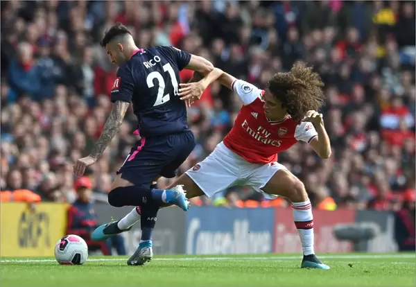 Arsenal vs. AFC Bournemouth: Matteo Guendouzi Tackles Diego Rico in Premier League Clash