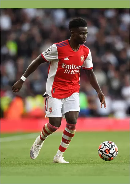 Arsenal's Bukayo Saka in Action against Tottenham Hotspur in the 2021-22 Premier League