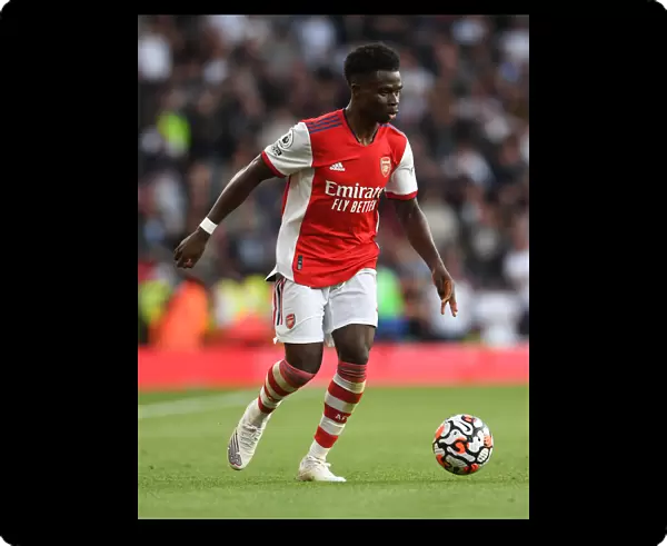 Arsenal's Bukayo Saka in Action against Tottenham Hotspur in the 2021-22 Premier League