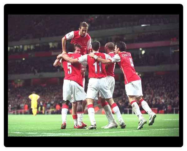 Kolo Toure celebrates scoring Arsenals 2nd goal with Mathieu Flamini