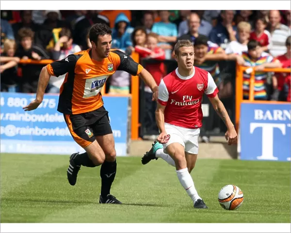 Jack Wilshere (Arsenal) Glenn Poole (Barnet). Barnet 0: 4 Arsenal. Pre Season Friendly