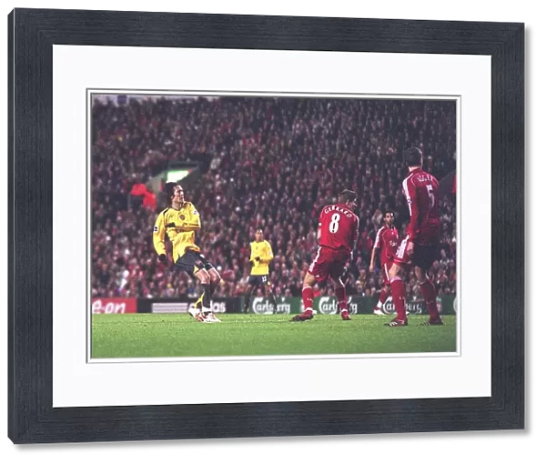 Tomas Rosicky shoots past Liverpool captain Steven Gerrard to score the 1st Arsenal goal