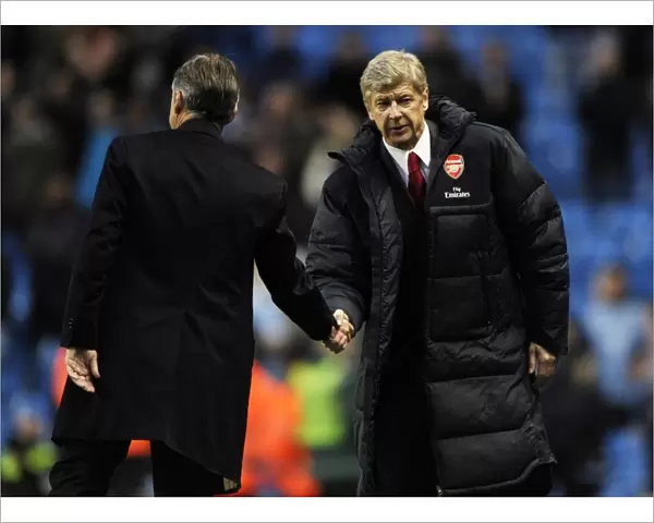 Managers Arsene Wenger (Arsenal) and Roberto Mancini (Man City) shake hands ast the end of the match. Manchester City 0: 3 Arsenal, Barclays Premier League, City Of Manchester Stadium, Manchester, 24  /  10  /  2010. Credit : Stuart MacFarlane  /  Arsenal