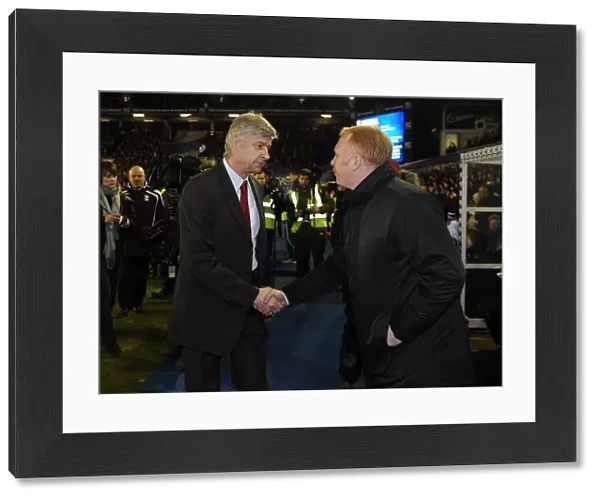 Managers Arsene Wenger (Arsenal) and Alex McLeish (Birmingham) shake hands before the match