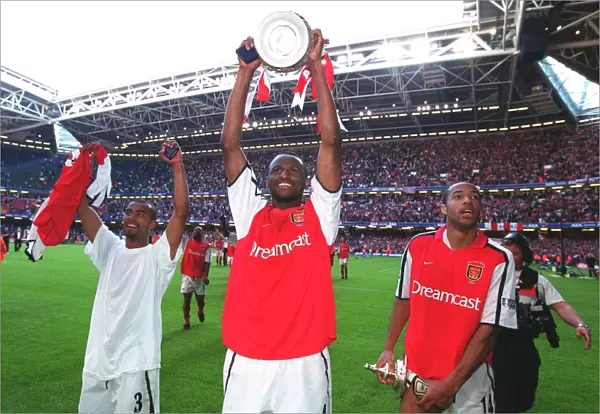 Patrick Vieira, Thierry Henry and Ashley Cole celebrate after the match