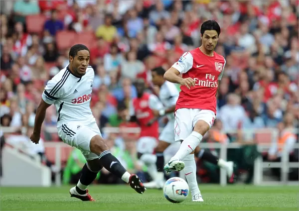 Mikel Arteta (Arsenal) Ashley Williams (Swansea). Arsenal 1: 0 Swansea City