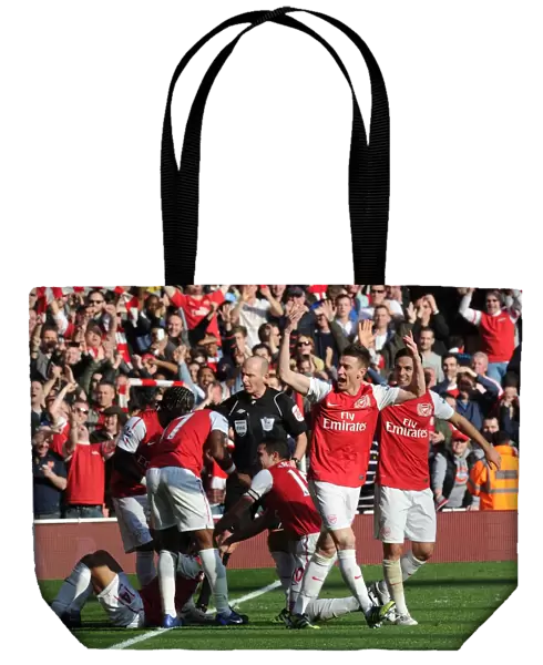Arsenal's Five-Goal Blitz: Koscielny and Arteta Celebrate Walcott's Goal vs. Tottenham (2011-12)