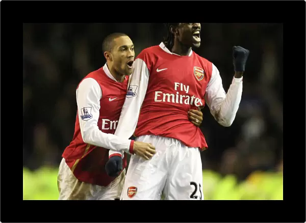 Emmanuel Adebayor and Gael Clichy celebrate Arsenals win at the end of the match