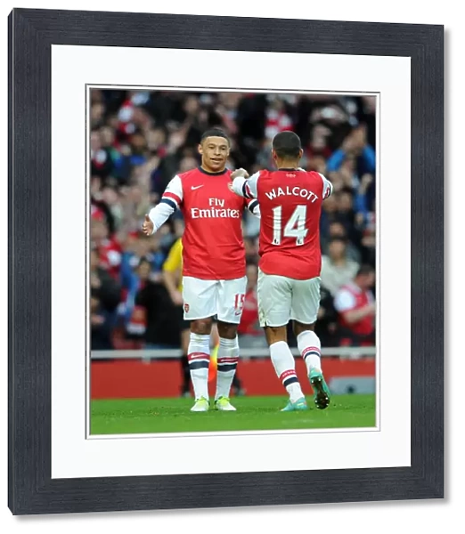 Arsenal's Double Act: Walcott and Oxlade-Chamberlain Celebrate Goal Against Tottenham (2012-13)