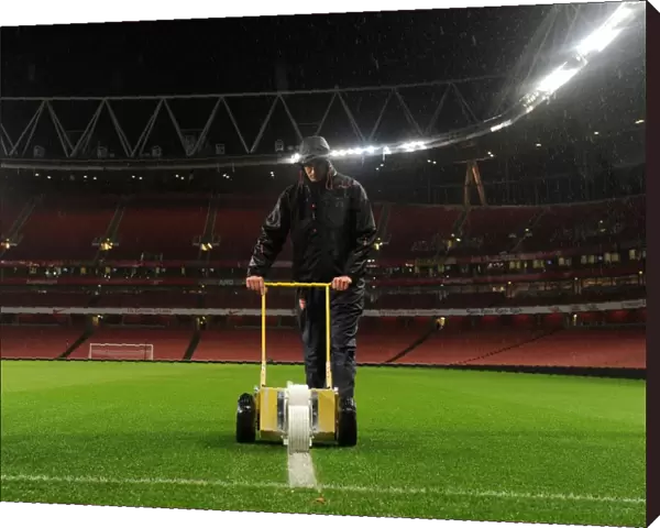 Arsenal's Unyielding Groundsman: Sion Bennett Braves the Rain to Prepare for Arsenal vs. Chelsea Showdown