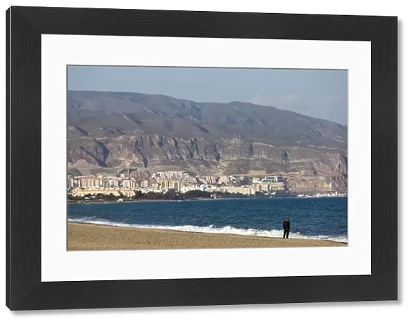 A lone figure on the beach at Roquetas de Mar in Spain