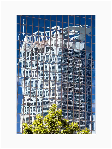 Reflections in the windows of an office block in Auckland, New Zealand