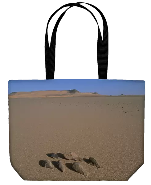 Stone tools on sand in a desert, Libyan Desert, Egypt
