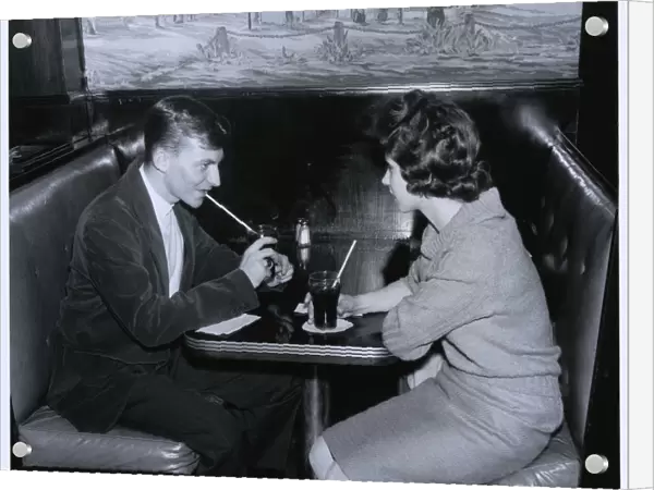 Couple drinking in a diner