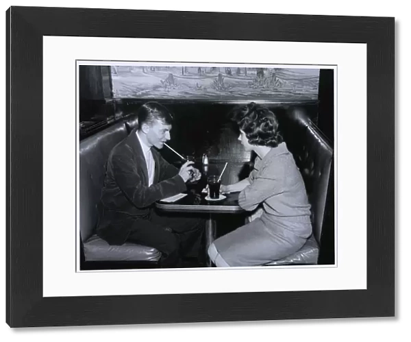 Couple drinking in a diner